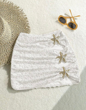 salida de bano blanca y beige en falda con estrellas de mar